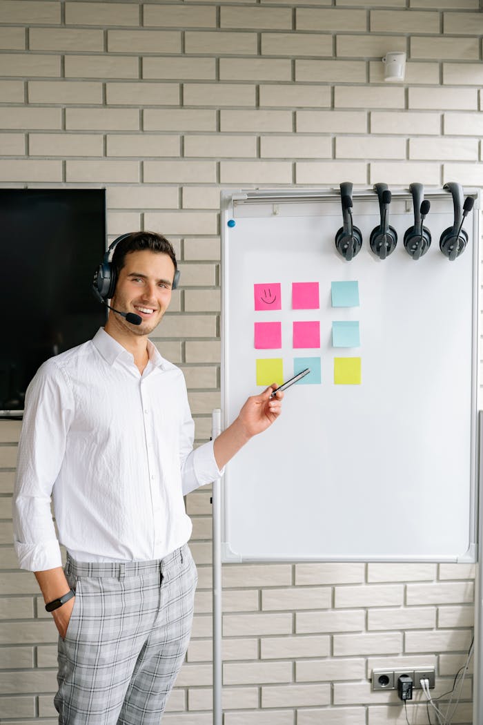 Professional man presenting with a headset in an office setting.